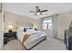 Serene main bedroom with a plush upholstered bed, soft carpet, and relaxing color palette at 9972 Trailing Vine St, Las Vegas, NV 89183