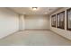 Bright bedroom featuring multiple windows with plantation shutters and neutral carpet at 10008 Peak Lookout St, Las Vegas, NV 89178