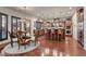 Dining room with chandelier, hardwood floors, and seating for six near the kitchen at 10008 Peak Lookout St, Las Vegas, NV 89178