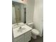 Bright bathroom with a vanity, toilet, and a shower-tub combination for convenience at 10047 Fine Fern St, Las Vegas, NV 89183