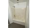 Bathroom featuring a bathtub-shower combination with tiled walls and fixtures at 10047 Fine Fern St, Las Vegas, NV 89183