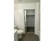 Bathroom featuring a vanity, toilet, and a sliding door to the connected closet space at 10047 Fine Fern St, Las Vegas, NV 89183