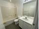 A full bathroom, features a tub and shower combination and a white vanity at 10047 Fine Fern St, Las Vegas, NV 89183