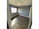 Bedroom with laminated wood floor and window at 10047 Fine Fern St, Las Vegas, NV 89183