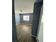 Bedroom with laminated wood floor and window at 10047 Fine Fern St, Las Vegas, NV 89183