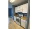 Modern kitchen with stainless steel appliances, tile floor, and granite counters at 10047 Fine Fern St, Las Vegas, NV 89183