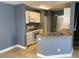 Open kitchen with stainless steel appliances, granite countertops, and an eat-in counter at 10047 Fine Fern St, Las Vegas, NV 89183