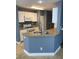 A modern kitchen features white cabinets, stainless steel appliances and granite countertops at 10047 Fine Fern St, Las Vegas, NV 89183