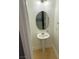 Cozy powder room with pedestal sink, decorative mirror and overhead lighting at 10047 Fine Fern St, Las Vegas, NV 89183