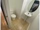 Practical half-bath with toilet and pedestal sink, perfect for guests at 10047 Fine Fern St, Las Vegas, NV 89183