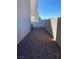 Gravel side yard with block wall and stucco wall on new home at 10047 Fine Fern St, Las Vegas, NV 89183