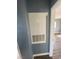Hallway view of utility box on blue painted wall at 10047 Fine Fern St, Las Vegas, NV 89183