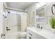 Clean bathroom with a modern sink vanity, coordinated decor, and a shower-tub combination at 1099 Sheer Paradise Ln # 1, Henderson, NV 89002