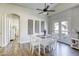 Bright dining room featuring a modern table set, stylish wall decor and access to the outdoors at 1099 Sheer Paradise Ln # 1, Henderson, NV 89002