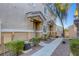 Attractive townhome featuring manicured landscaping, a walkway, and cozy front porch entries at 1099 Sheer Paradise Ln # 1, Henderson, NV 89002