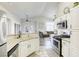 Modern kitchen with stainless appliances, lots of counter space, and an open view of the living area at 1099 Sheer Paradise Ln # 1, Henderson, NV 89002