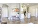 Open-concept layout featuring a modern kitchen with stainless steel appliances and ample counter space at 1099 Sheer Paradise Ln # 1, Henderson, NV 89002