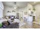 Cozy living area with ceiling fan flows seamlessly into the kitchen with modern appliances and decor at 1099 Sheer Paradise Ln # 1, Henderson, NV 89002