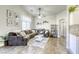 Inviting living room with a large sofa, soft rug, and lots of natural light, perfect for relaxation at 1099 Sheer Paradise Ln # 1, Henderson, NV 89002