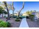 Community park with picnic tables under shaded structures, with a concrete walkway at 1099 Sheer Paradise Ln # 1, Henderson, NV 89002