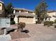 Two-story home with desert landscaping and a two-car garage on a sunny day at 11009 Royal Highlands St, Las Vegas, NV 89141