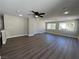 Spacious living room with hardwood floors, recessed lighting, and multiple windows at 11009 Royal Highlands St, Las Vegas, NV 89141