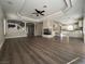 Spacious living room with modern flooring, fireplace, and open layout at 11009 Royal Highlands St, Las Vegas, NV 89141