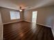 Primary bedroom with wood floors and ensuite bathroom at 11009 Royal Highlands St, Las Vegas, NV 89141