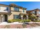 Charming townhome featuring desert landscaping, arched entryway and neutral color palette at 11396 Ogden Mills Dr # 101, Las Vegas, NV 89135
