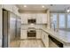 Modern kitchen with stainless steel appliances, sleek countertops, and ample storage space for all your culinary needs at 11396 Ogden Mills Dr # 101, Las Vegas, NV 89135