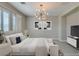 Comfortable main bedroom showcasing modern furnishings, soft lighting, and a peaceful ambiance for ultimate relaxation at 11396 Ogden Mills Dr # 101, Las Vegas, NV 89135