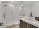 Modern bathroom featuring sleek walk-in shower, white countertops, and stylish vanity at 1320 Enchanted River Dr, Henderson, NV 89012