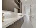 Modern butler's pantry with sleek cabinets, white countertops, and open shelving at 1320 Enchanted River Dr, Henderson, NV 89012