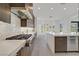 Open kitchen with stainless steel appliances, a center island, and abundant counter space at 1320 Enchanted River Dr, Henderson, NV 89012