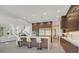 Gourmet kitchen featuring stainless steel appliances, a large island, and sleek cabinetry at 1320 Enchanted River Dr, Henderson, NV 89012