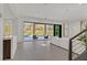 Spacious living area with a wall of sliding doors to the pool and patio at 1320 Enchanted River Dr, Henderson, NV 89012