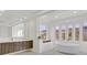 Bright main bathroom with standalone tub and dual vanity at 1320 Enchanted River Dr, Henderson, NV 89012