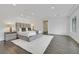 Large main bedroom featuring white rug, hardwood floors and king size bed at 1320 Enchanted River Dr, Henderson, NV 89012