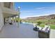 Stunning backyard pool with an outdoor seating area and a picturesque mountain view at 1320 Enchanted River Dr, Henderson, NV 89012