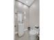 Modern powder room featuring a unique pedestal sink and contemporary fixtures at 1320 Enchanted River Dr, Henderson, NV 89012