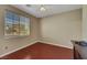 Comfortable bedroom featuring a ceiling fan and natural light from the large window at 1372 Coppelia Ct, Henderson, NV 89052