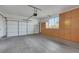 Spacious garage features a door, concrete floor, and built in cabinets at 1372 Coppelia Ct, Henderson, NV 89052