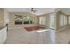 Inviting living room with fireplace, tile flooring, and lots of natural light at 1372 Coppelia Ct, Henderson, NV 89052