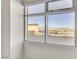 A large window with views of nearby buildings and distant mountains at 150 Las Vegas Blvd # 818, Las Vegas, NV 89101