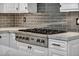 Close up of kitchen with high-end stovetop and sleek backsplash at 177 Knollwood Ct, Henderson, NV 89074