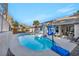 Backyard pool and patio area featuring ample space for lounging, outdoor recreation, and entertaining guests at 177 Knollwood Ct, Henderson, NV 89074