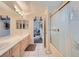 Bathroom features marble countertops, double sinks, and a shower with glass doors at 1831 Rosemere Ct, Las Vegas, NV 89117