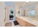Bathroom features marble countertops, a large mirror, and double sinks at 1831 Rosemere Ct, Las Vegas, NV 89117
