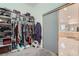 Spacious walk-in closet with custom shelving, rods, and convenient access to primary bath at 1831 Rosemere Ct, Las Vegas, NV 89117