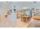 Bright dining area with ample seating, wall decor, and a view into the kitchen at 1831 Rosemere Ct, Las Vegas, NV 89117